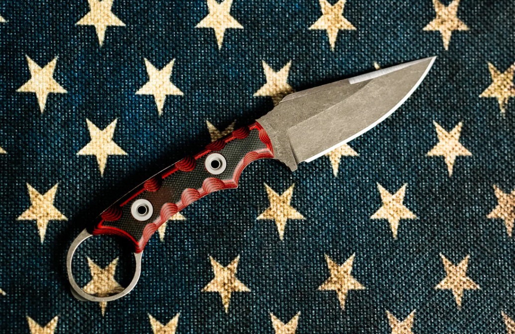 Military knife on american flag